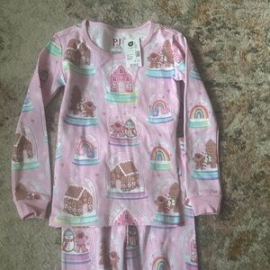 The Children's Place Pink Pajama Set with Gingerbread and Rainbow Design